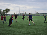 Laatste training S.K.N.W.K. JO11-1JM (partijtje tegen de ouders) van maandag 27 mei 2024 (27/137)